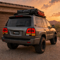 1998-2007 Toyota Land Cruiser 100 Sequential LED Tail Lights Assembly — sunset parking view — T-LC100-98-RW