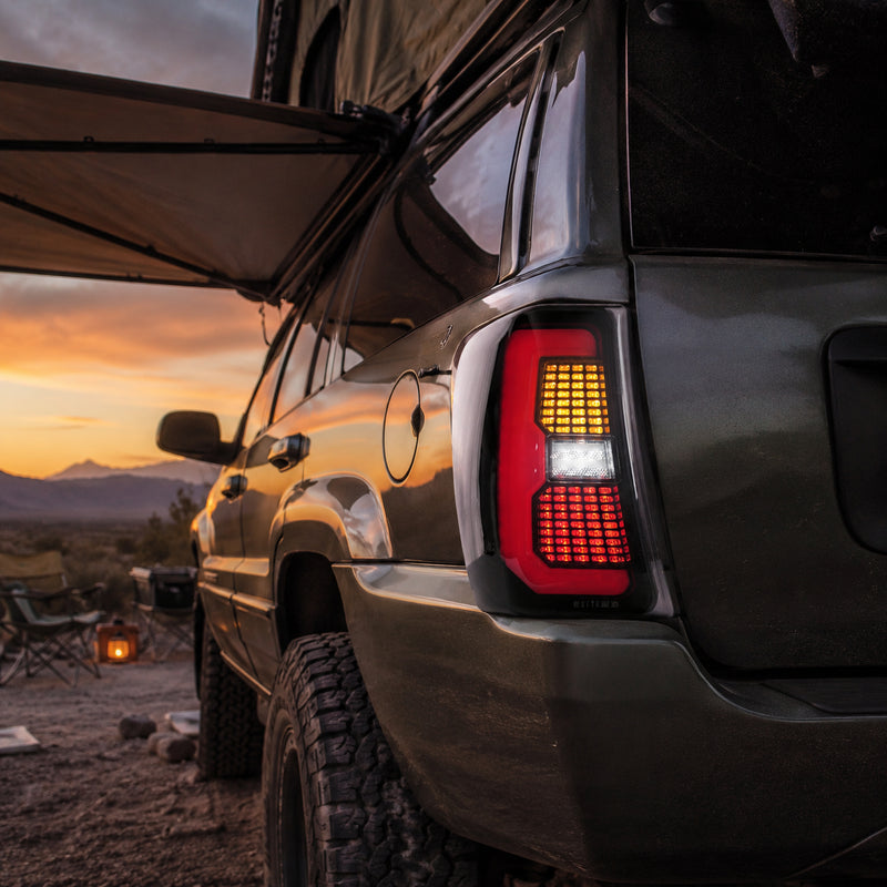 1999-2004 Jeep Grand Cherokee Sequential LED Tail Lights — smoked scene camping dusk