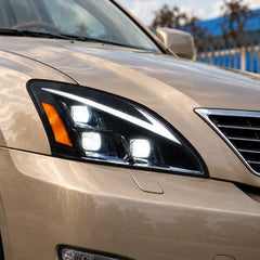 2004-2009 Lexus RX330 / RX350 / RX400h (XU30) LED Triple Projector Headlights Assembly — Pair — Installed illuminated headlight close-up — H-RX04-3P