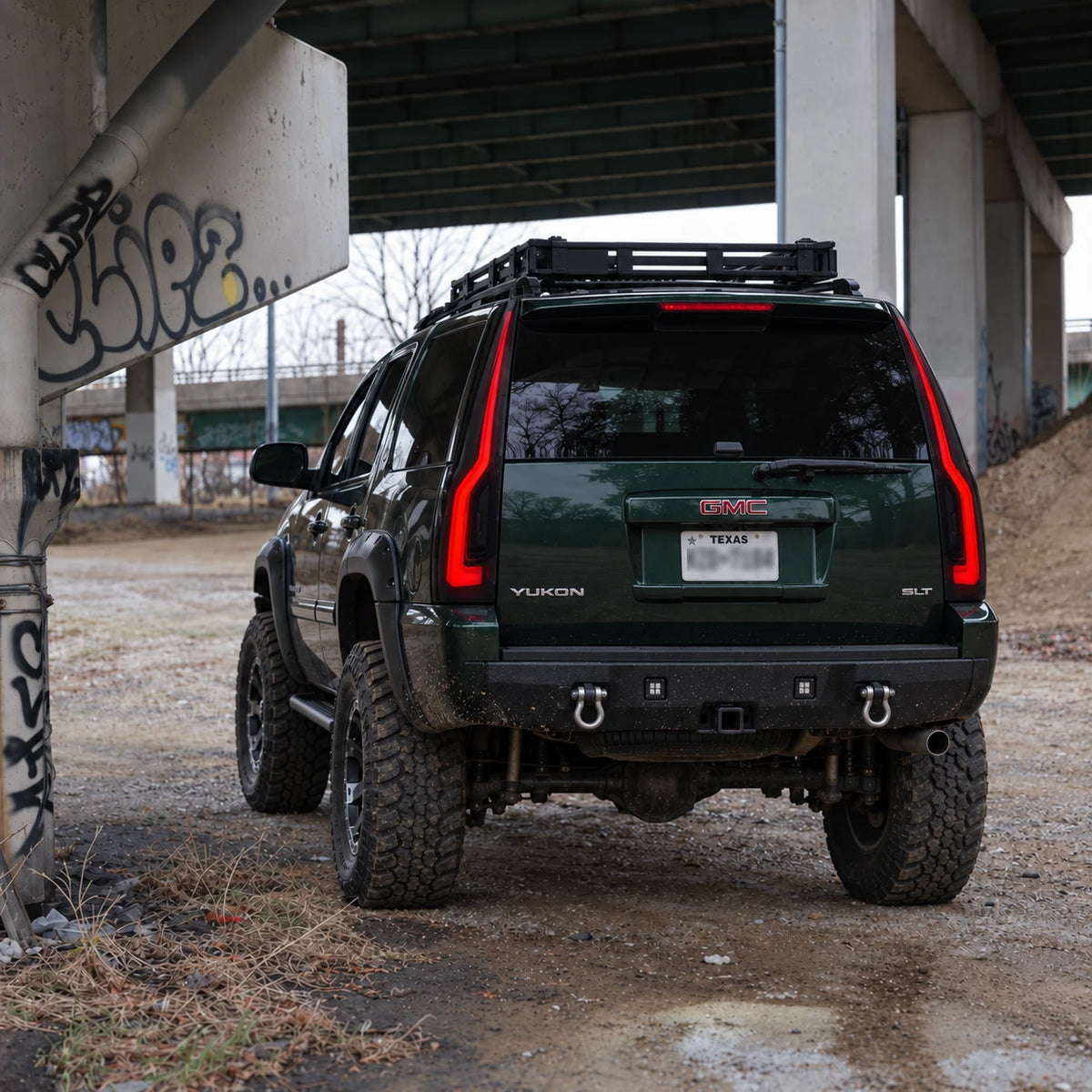 2007-2014 GMC Yukon & Cadillac Escalade LED Tail Lights Assembly — off-road rear view under overpass — T-YUK07-SR