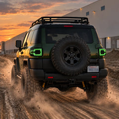 2007-2014 Toyota FJ Cruiser Sequential LED Tail Lights Assembly — Pair (Halo - Smoked RGB) — Green lighting sunset off-road scene — T-FJ-HL-SRGB