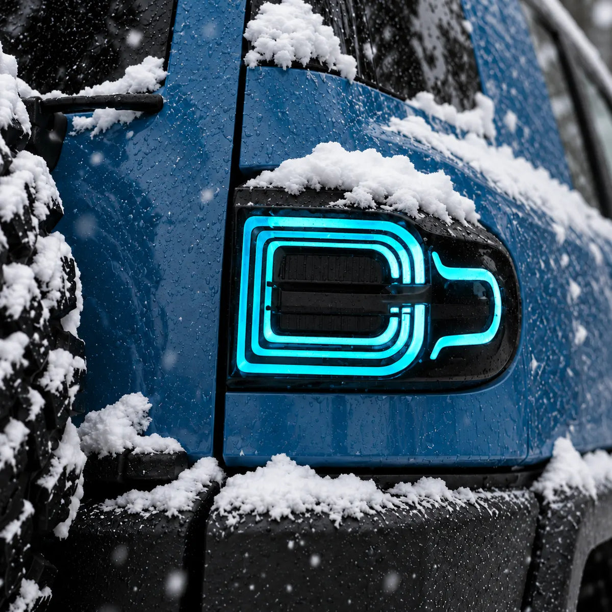 2007-2014 Toyota FJ Cruiser Sequential LED Tail Lights Assembly — Pair (Halo - Smoked RGB) — Blue halo light snowy close-up — T-FJ-HL-SRGB