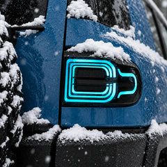 2007-2014 Toyota FJ Cruiser Sequential LED Tail Lights Assembly — Pair (Halo - Smoked RGB) — Blue halo light snowy close-up — T-FJ-HL-SRGB