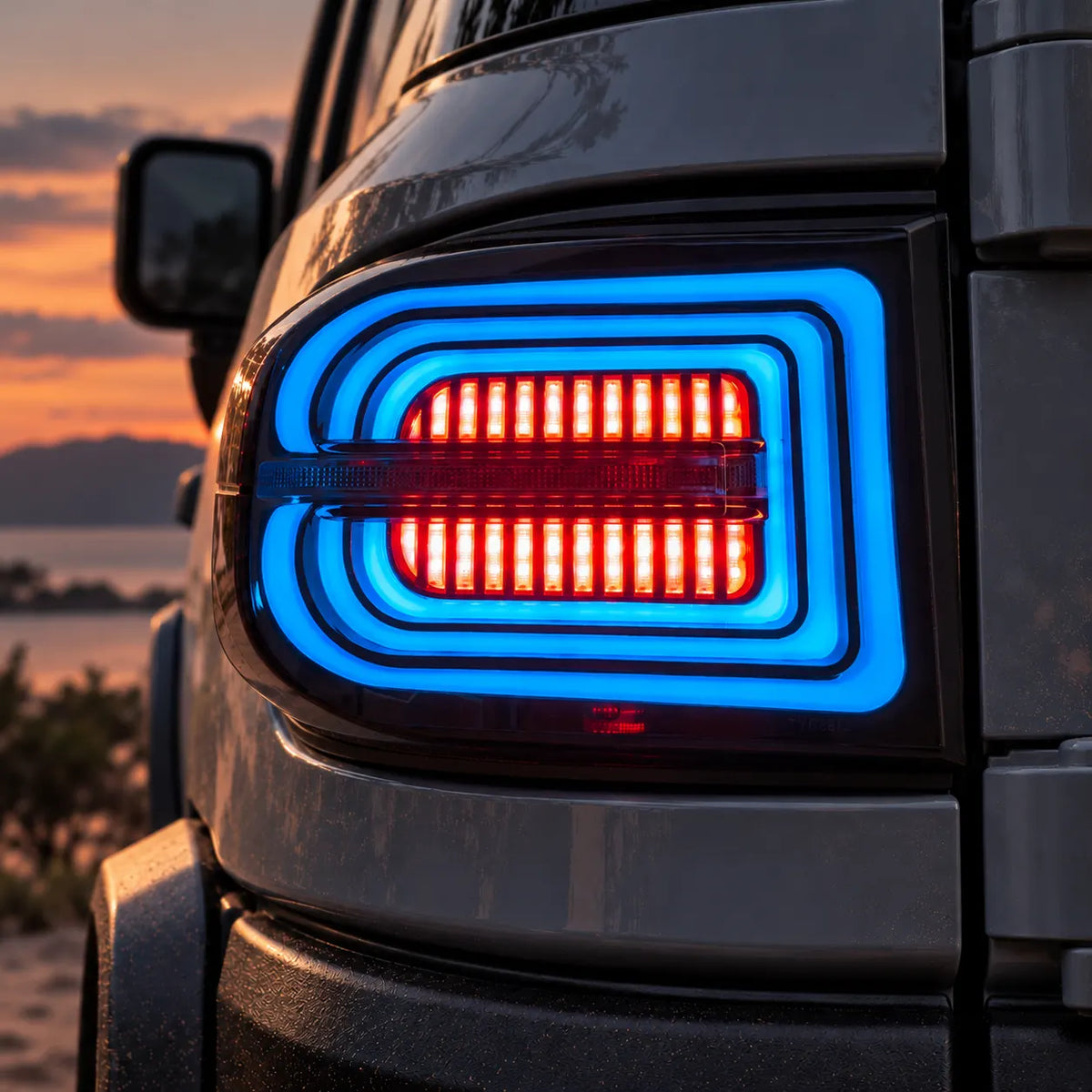 2007-2014 Toyota FJ Cruiser Sequential LED Tail Lights Assembly — Pair (Halo - Smoked RGB) — Blue RGB halo illuminated close-up — T-FJ-HL-SRGB