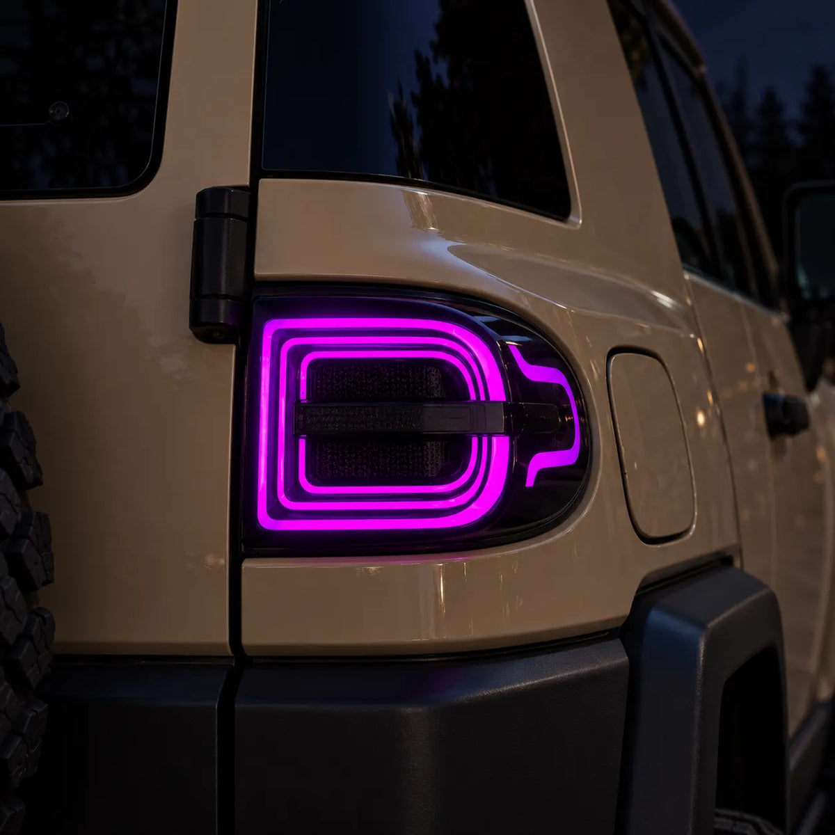 2007-2014 Toyota FJ Cruiser Sequential LED Tail Lights Assembly — Pair (Halo - Smoked RGB) — Purple halo nighttime close-up — T-FJ-HL-SRGB