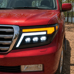 2008-2015 Toyota Land Cruiser 200 LED Triple Projector Headlights Assembly — lights-on close-up — H-LC200-08