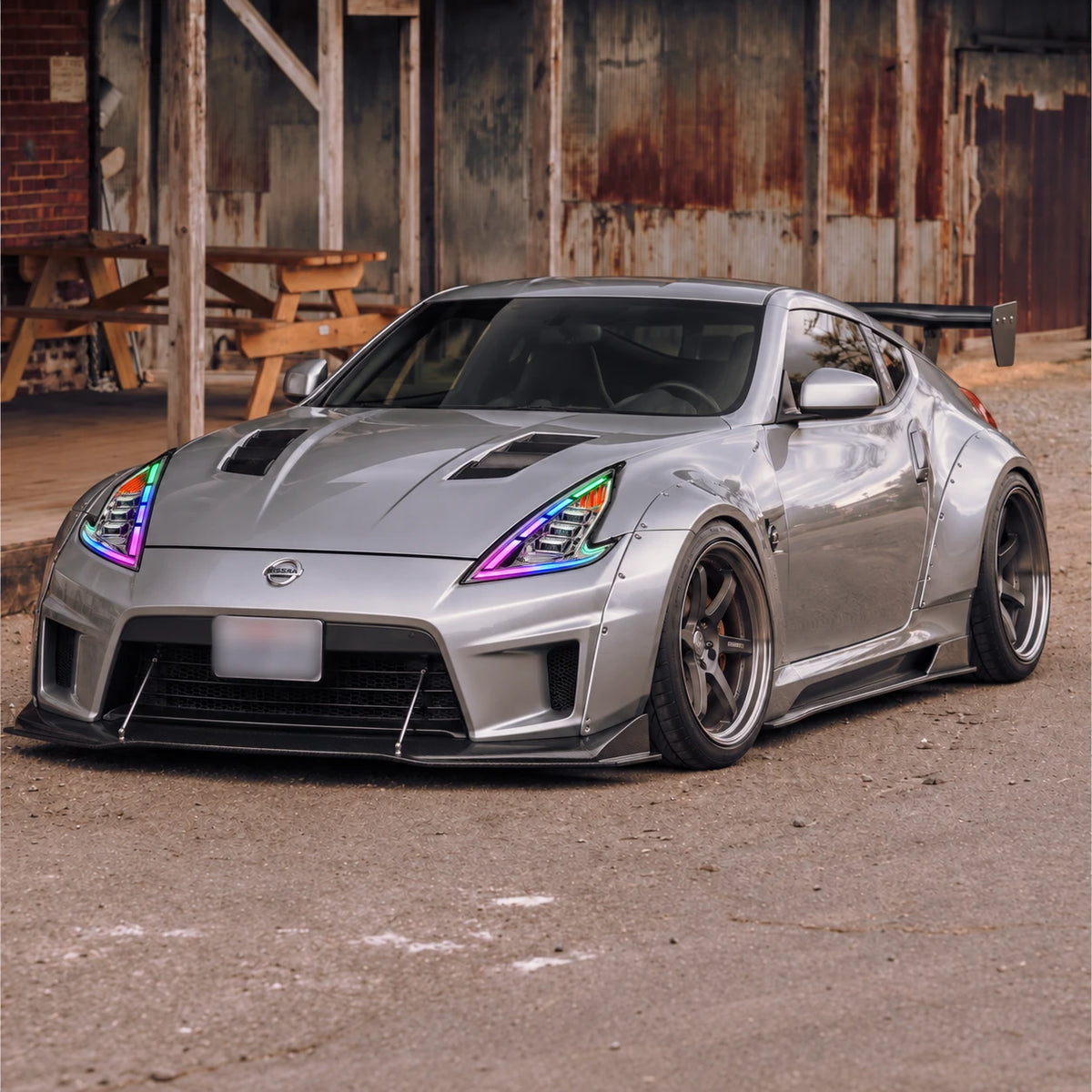 2009-2020 Nissan 370Z Z34 LED Triple Projector Headlights Assembly — aggressive front-end view — H-370Z08-CH-RGB
