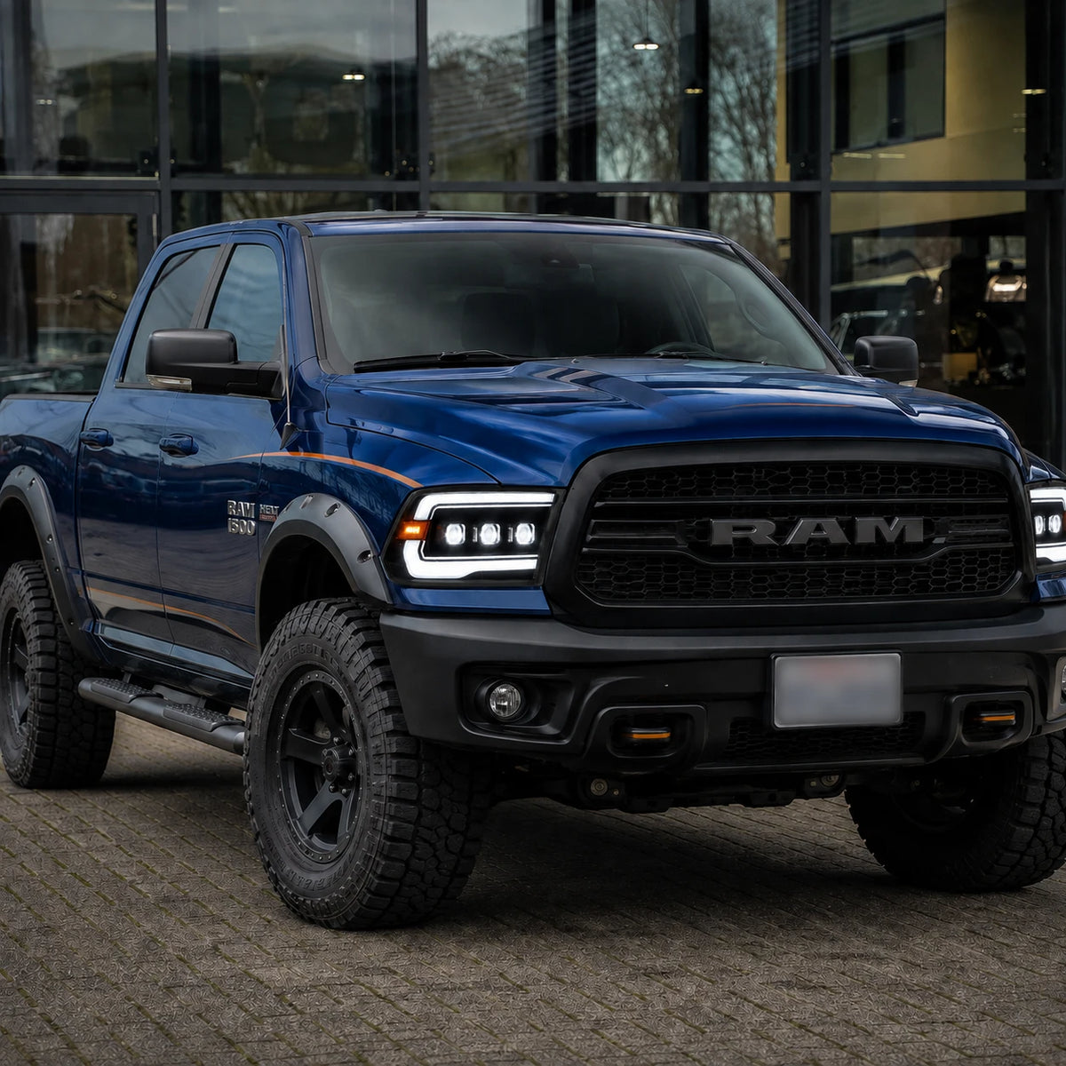2009-2018 Ram 1500/2500/3500 and 2019-2024 Ram 1500 Classic LED Triple Projector Headlights — lights-on in urban street — H-RAM09