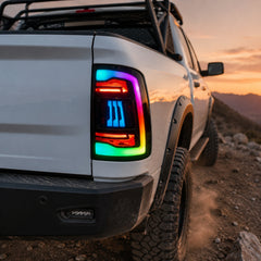 2009-2018 Dodge Ram 1500/2500/3500 Sequential LED Tail Lights — rgbsmoked rainbow low angle trail scene - T-RAM09-SRGB