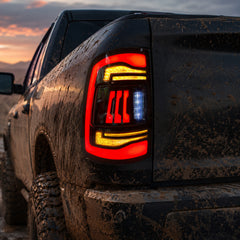2009-2018 Dodge Ram 1500/2500/3500 Sequential LED Tail Lights — smoked sequential mud trail detail scene - T-RAM09-CR