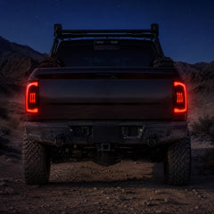 2009-2018 Dodge Ram 1500/2500/3500 Sequential LED Tail Lights — smoked sequential night rear view - T-RAM09-CR