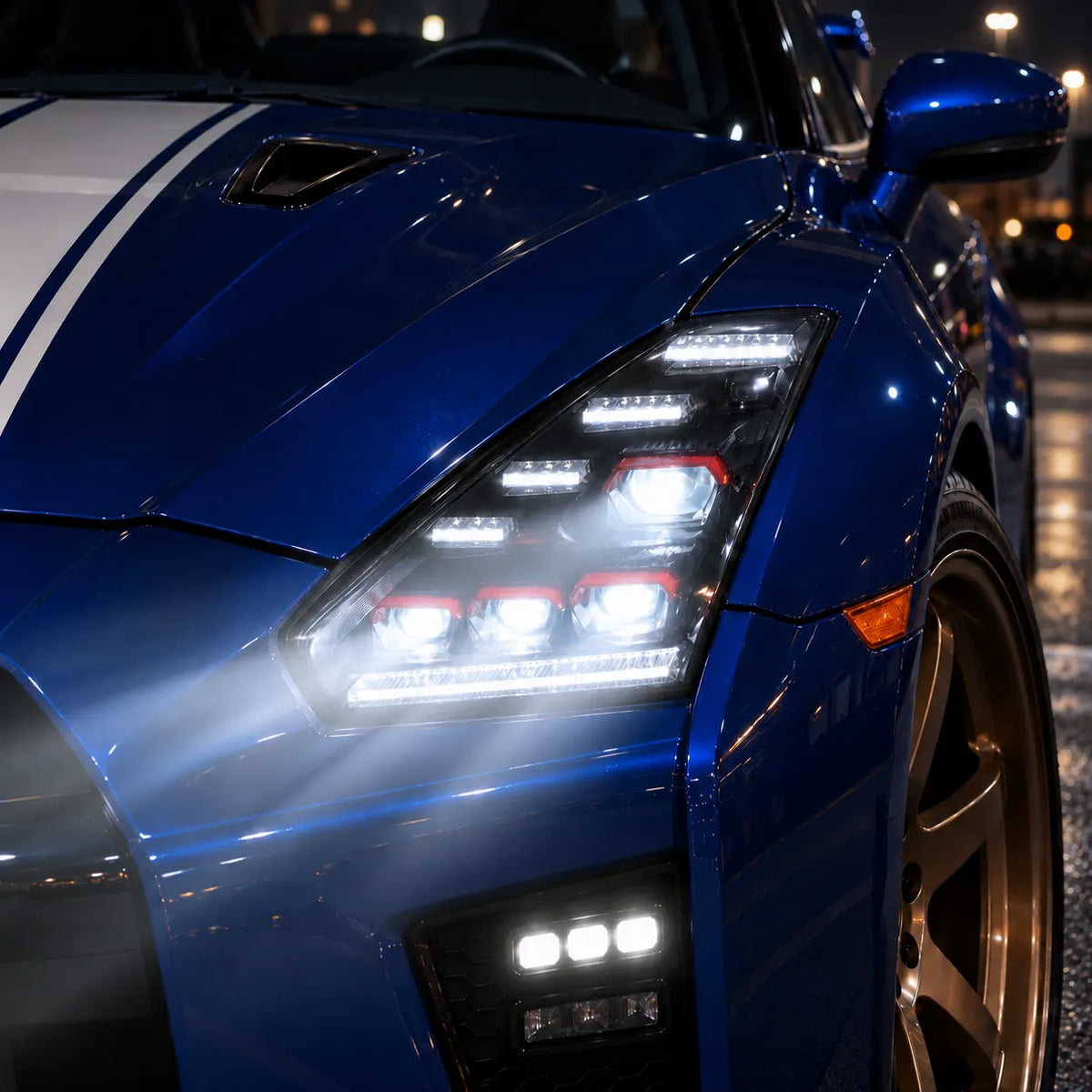 2009-2024 Nissan GT-R R35 LED Quad Projector Headlights Assembly — Pair — Blue GT-R illuminated headlight close-up — H-GTR09