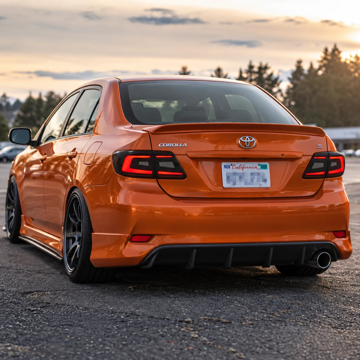 2011-2013 Toyota Corolla Sequential LED Tail Lights Assembly — rear three-quarter sunset driving view — T-COR11-SR