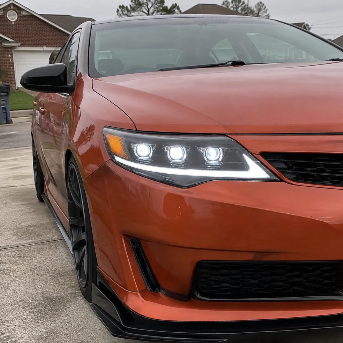 2012-2014 Toyota Camry LED Triple Projector Headlights Assembly — house front close-up look — H-CAM12-A