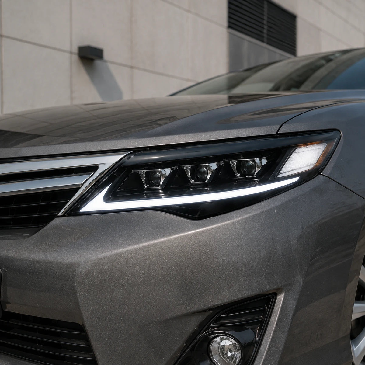 2012-2014 Toyota Camry LED Triple Projector Headlights Assembly — close-up in daylight — H-CAM12-CW