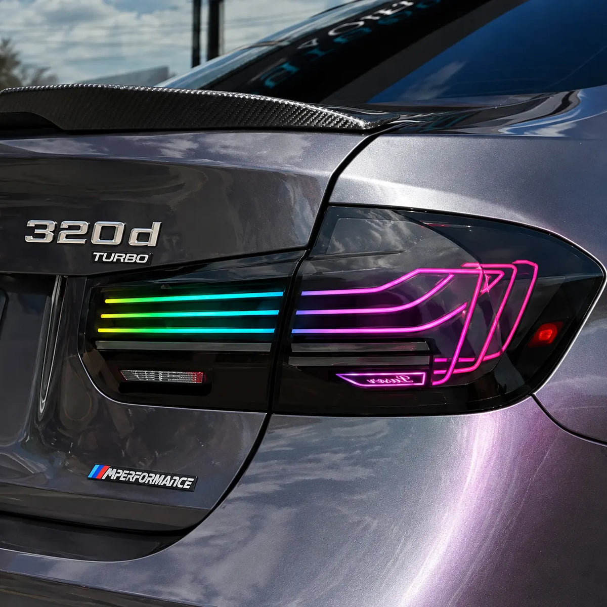 2012-2018 BMW 3 Series F30 / M3 F80 Sequential LED Tail Lights Assembly — 4-Piece Set — RGB tail light close-up on gray car — T-3F30-SRGB