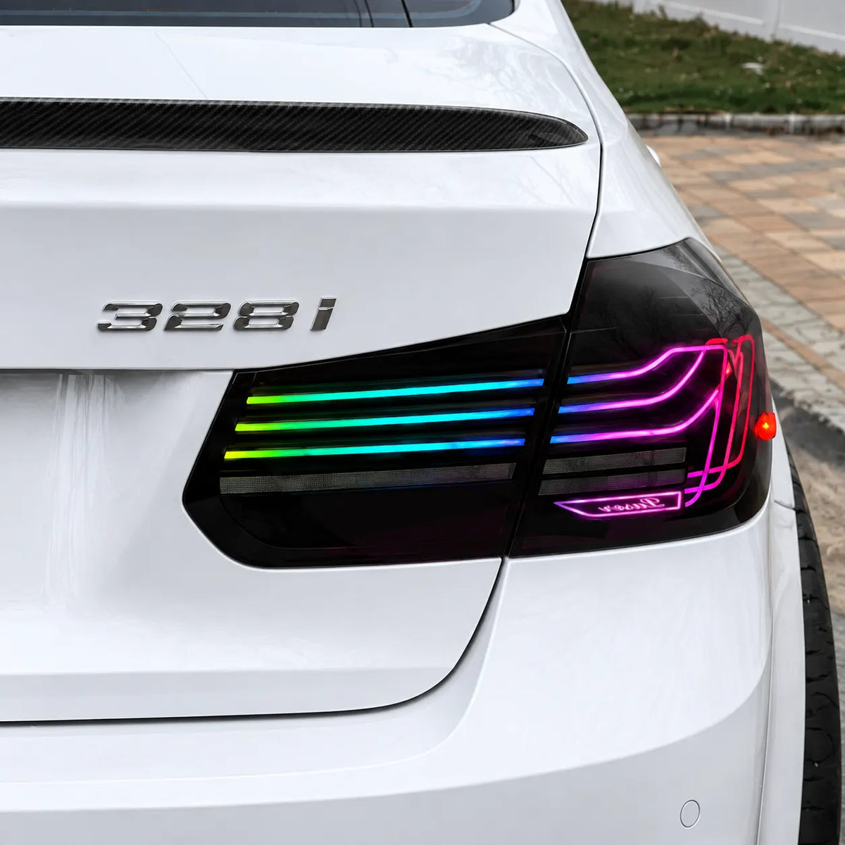2012-2018 BMW 3 Series F30 / M3 F80 Sequential LED Tail Lights Assembly — 4-Piece Set — RGB tail light close-up on white car — T-3F30-SRGB
