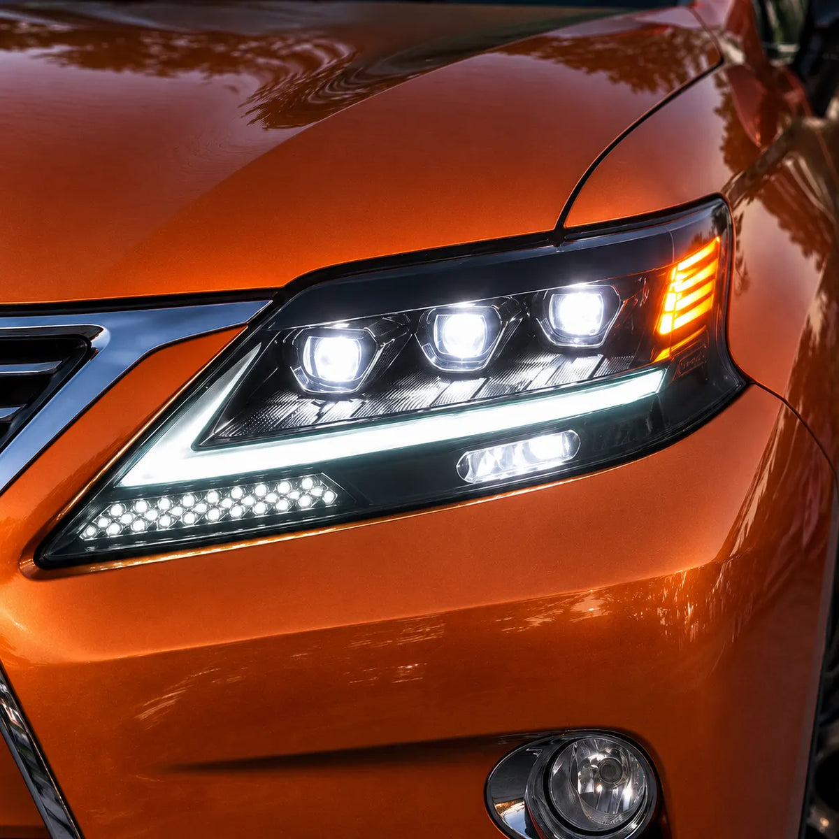2013-2015 Lexus RX350 / RX450h LED Quad Projector Headlights Assembly — Pair — Illuminated headlight close-up — H-RX13-4P