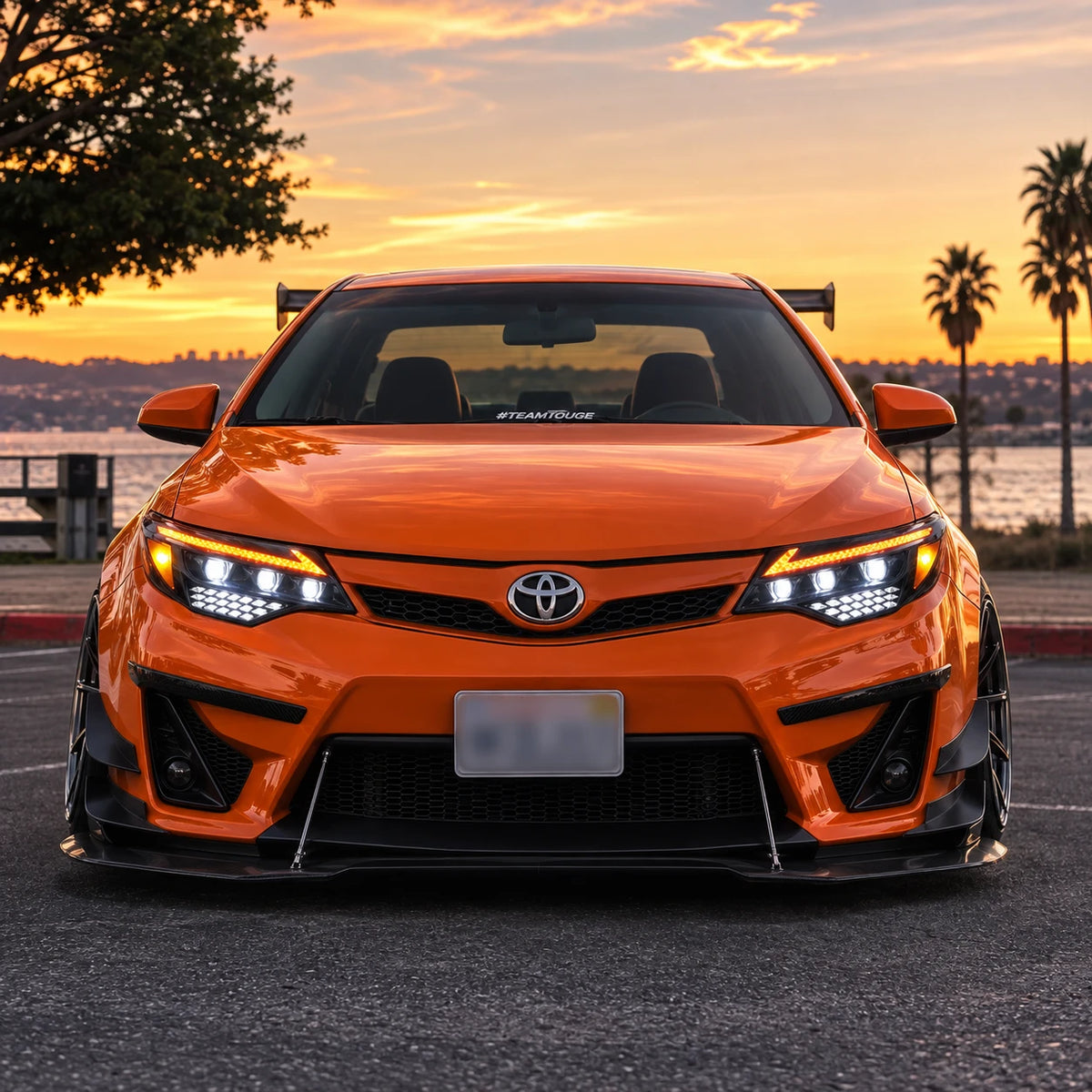 2015-2017 Toyota Camry LED Triple Projector Headlights Assembly — front view in sunset — H-CAM15-A