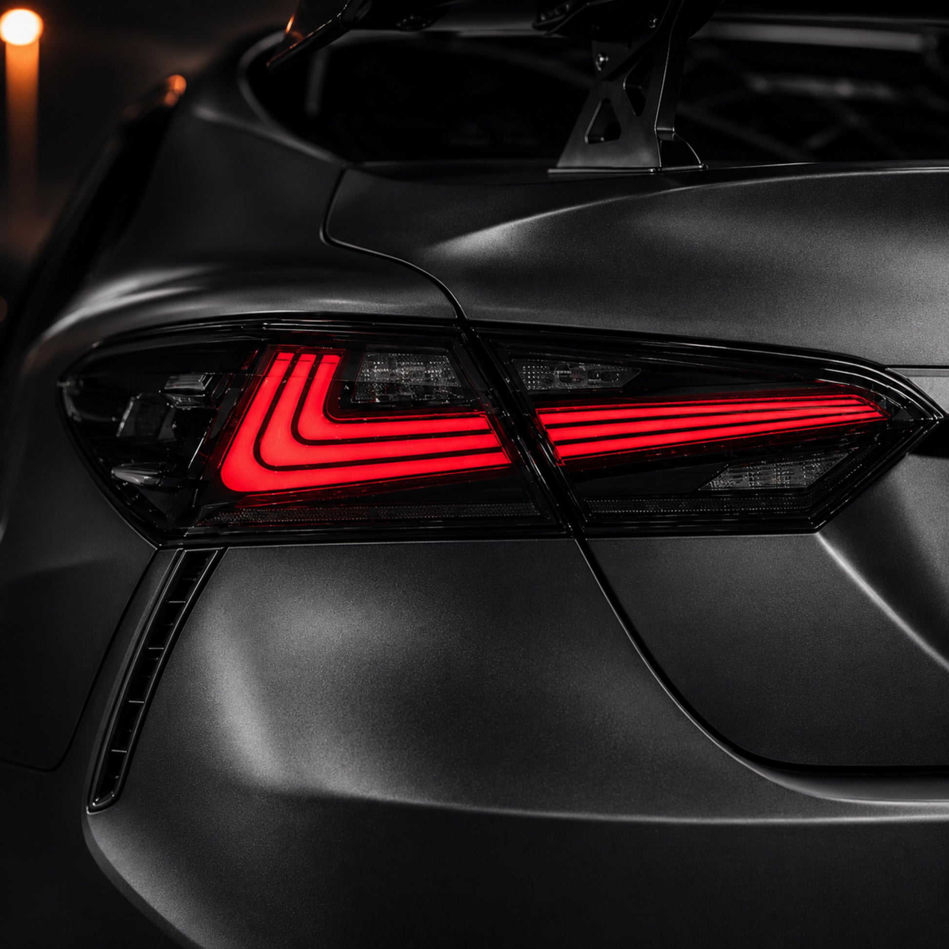 2018-2024 Toyota Camry 8th Gen Sequential LED Tail Lights — smoked red rectilinear lens detail close up - T-CAM18-HL-SR
