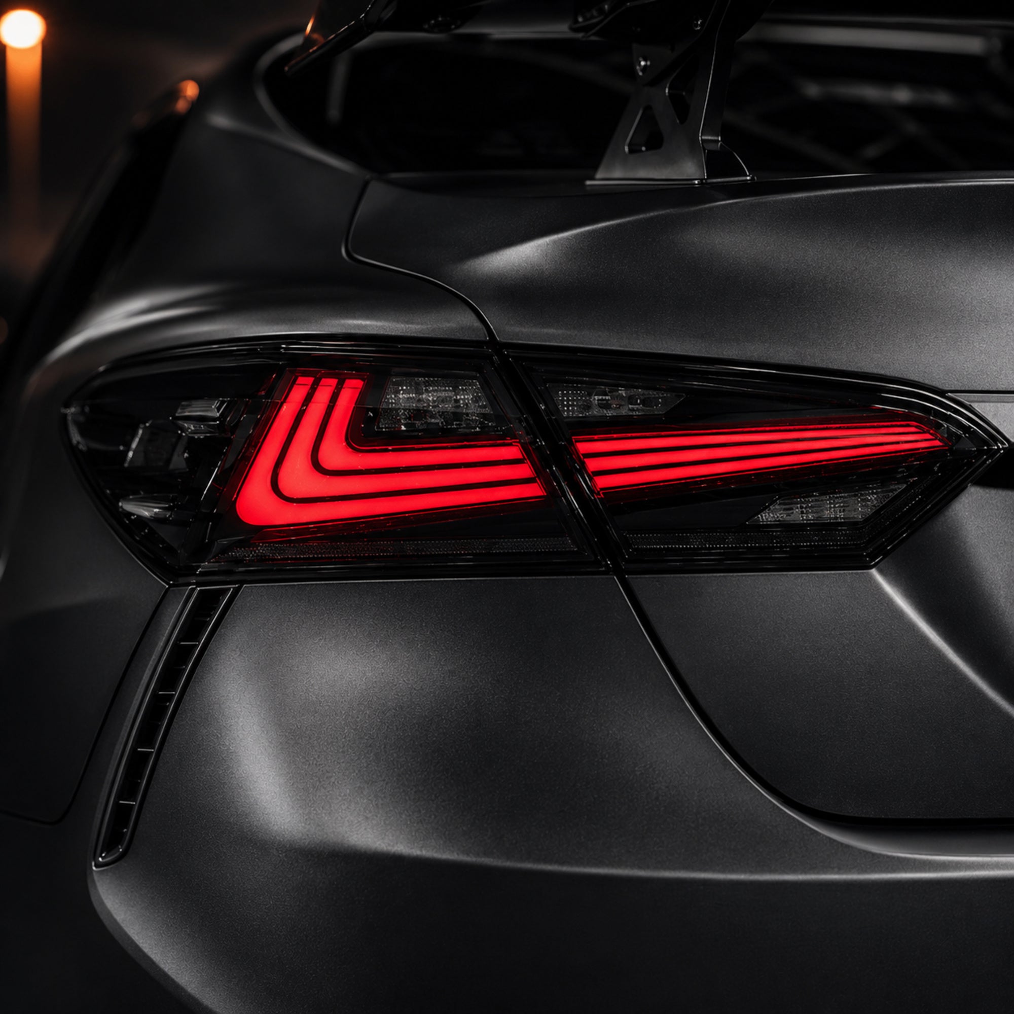 2018-2024 Toyota Camry 8th Gen Sequential LED Tail Lights — smoked red rectilinear lens detail close up - T-CAM18-HL-SR