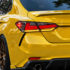2018-2024 Toyota Camry 8th Gen Sequential LED Tail Lights Assembly — 4-Piece Set (Halo - Clear White) — Amber turn signal installed on yellow Camry — T-CAM18-HL-CW