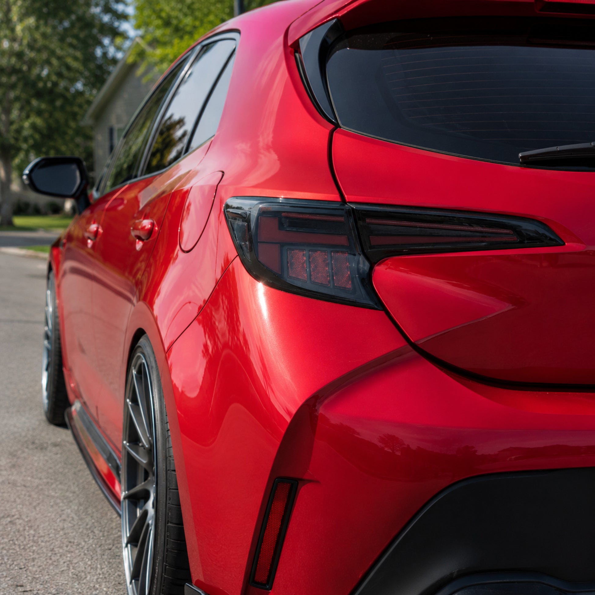 2019-2025 Toyota Corolla Hatchback & GR Corolla Sequential LED Tail Lights — smoked red day unlit exterior — T-COR19