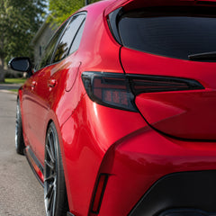 2019-2025 Toyota Corolla Hatchback & GR Corolla Sequential LED Tail Lights — smoked red day unlit exterior — T-COR19