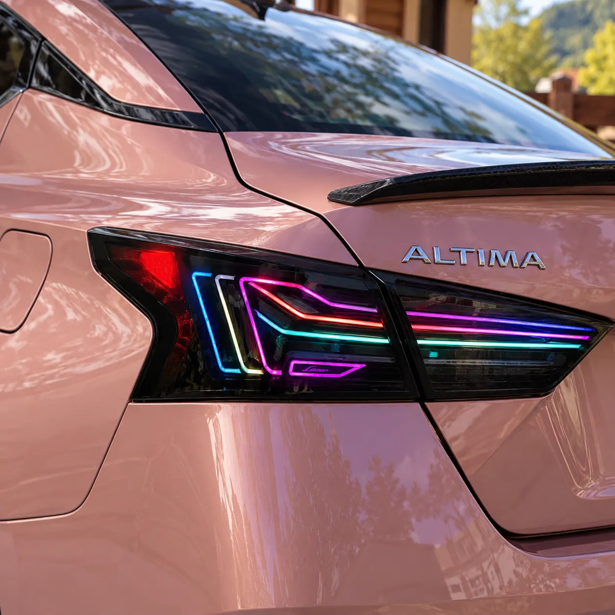 2019-2026 Nissan Altima Sequential Laser LED Tail Lights Assembly — 4-Piece Set — RGB tail light close-up on pink Altima — T-ALT19-SRGB