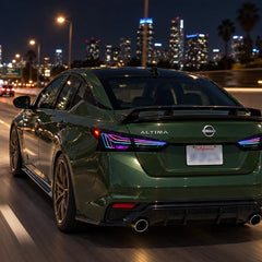 2019-2026 Nissan Altima Sequential Laser LED Tail Lights Assembly — 4-Piece Set — RGB tail lights on green Altima at night — T-ALT19-SRGB