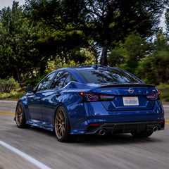 2019-2026 Nissan Altima Sequential Laser LED Tail Lights Assembly — 4-Piece Set — RGB tail lights on blue Altima driving — T-ALT19-SRGB