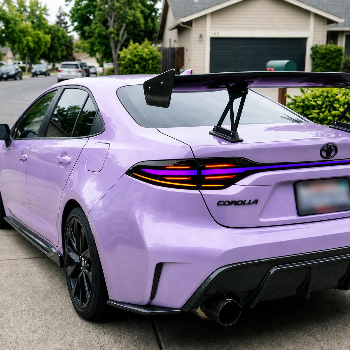 2020-2026 Toyota Corolla Sedan Sequential LED Tail Lights Assembly Full-Width Bar — street parking view — T-COR20-RGB
