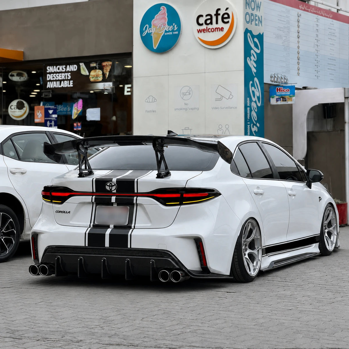 2020-2026 Toyota Corolla Sedan Sequential LED Tail Lights Assembly Full-Width Bar — mall front parking — T-COR20-SRT