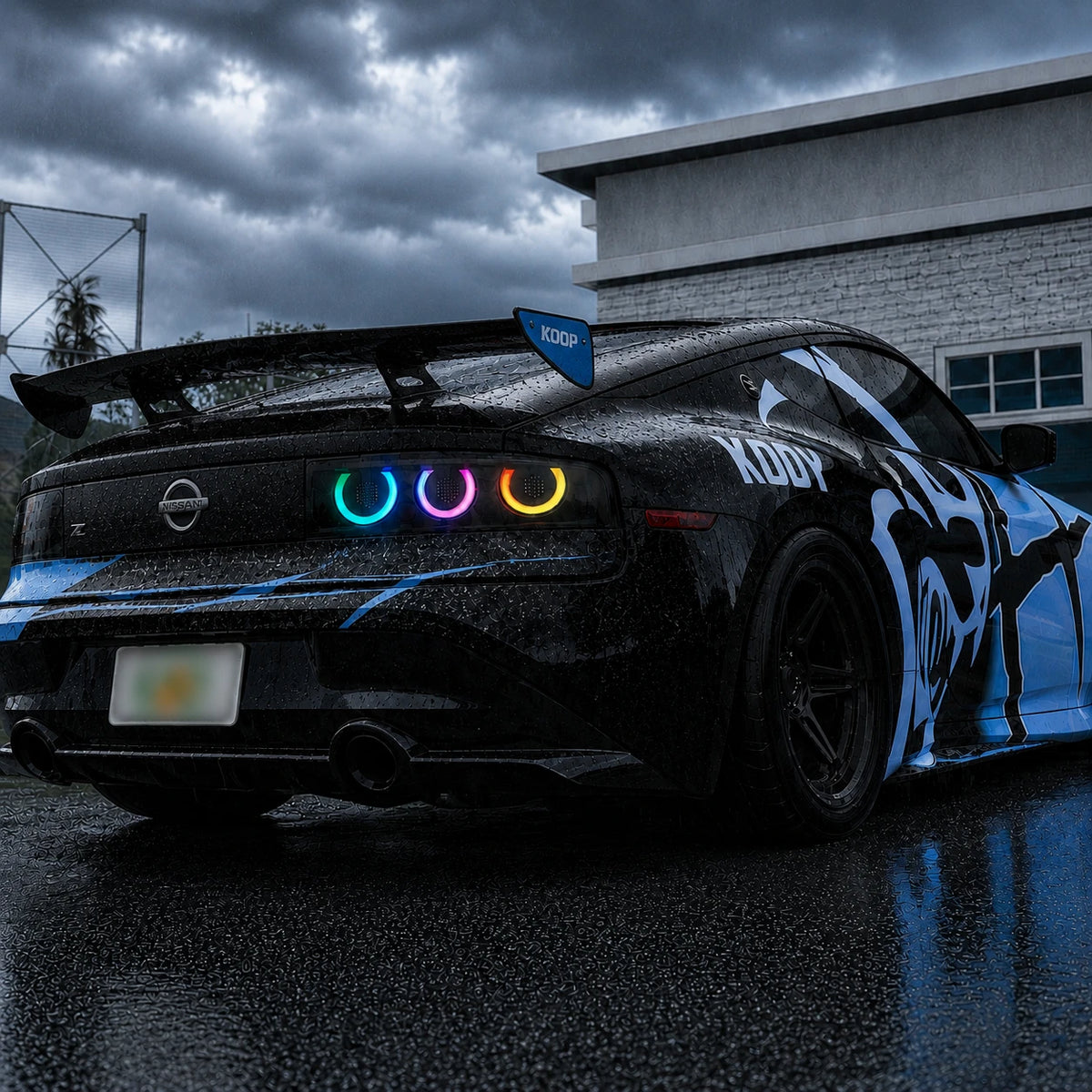 2023-2026 Nissan Z (400Z) RZ34 Triple Halo Sequential LED Tail Lights Assembly — rainy daylight view — 
T-400Z23-RGB